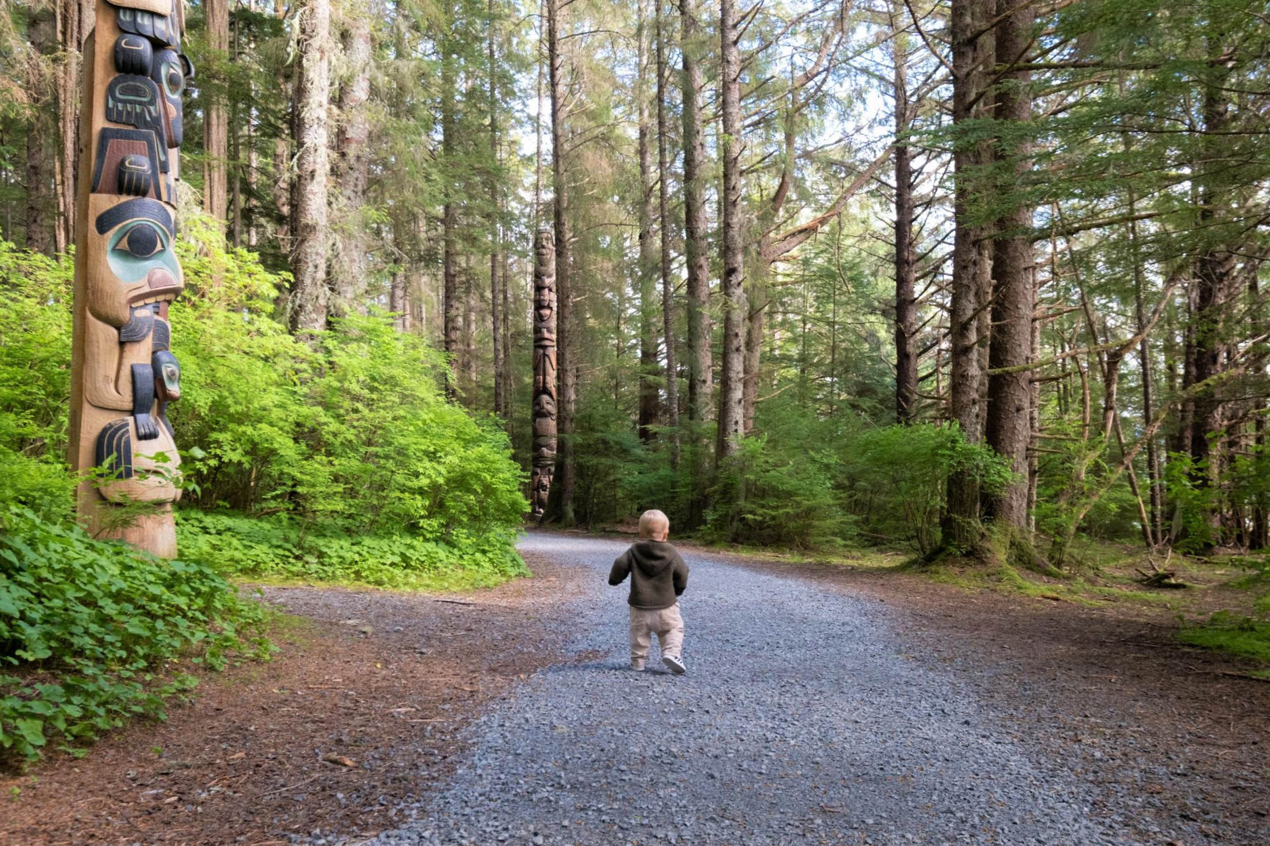 Child walks trail in Alaska's Inside Passage region