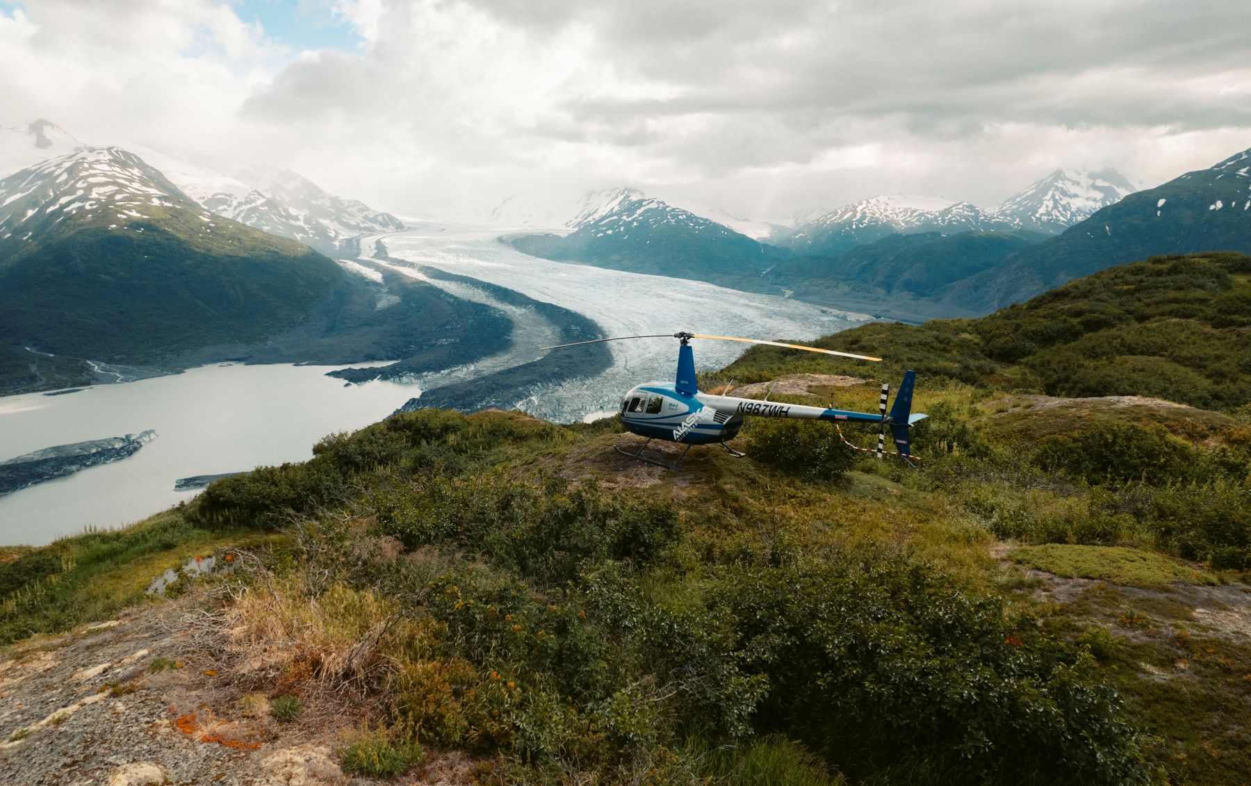 A helicopter in front of Knik Glacier