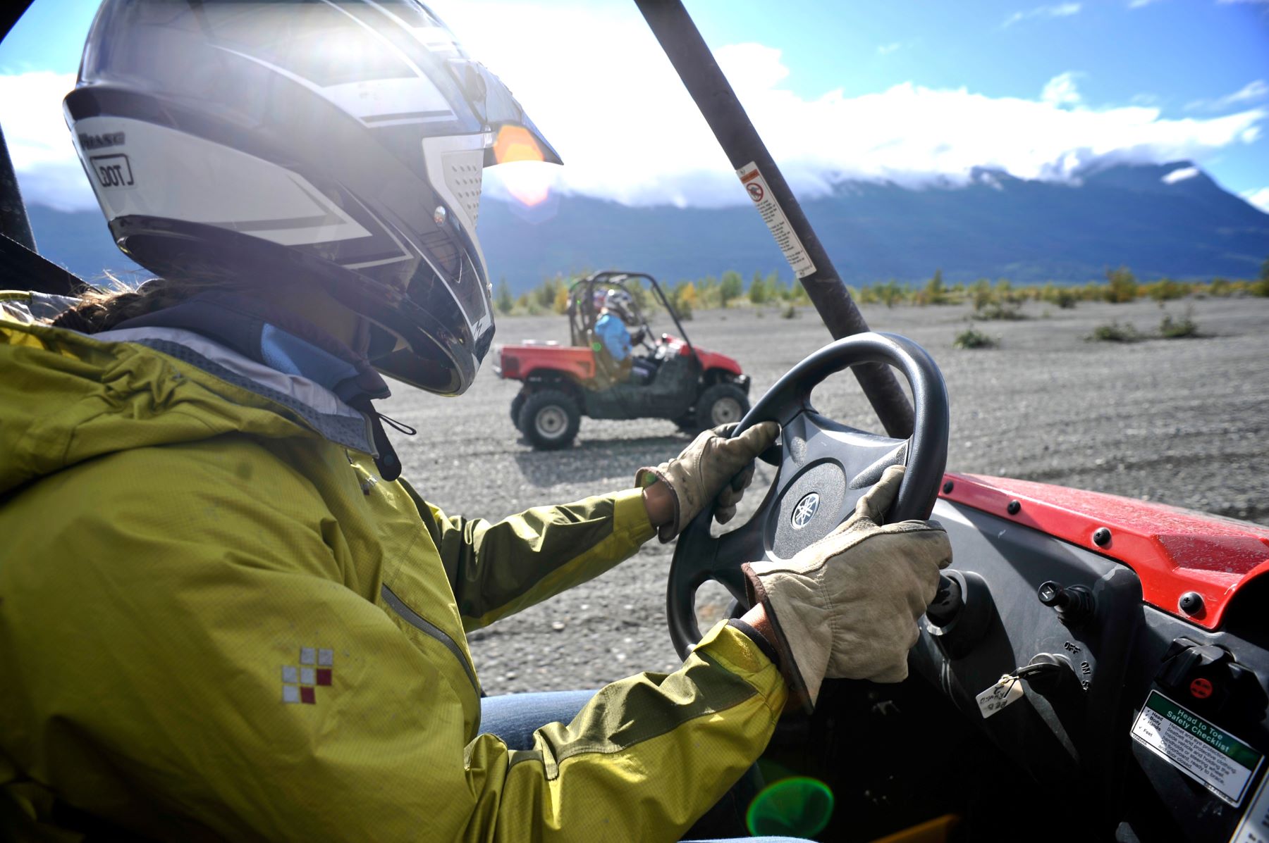 A person drives an ATV in Alaska