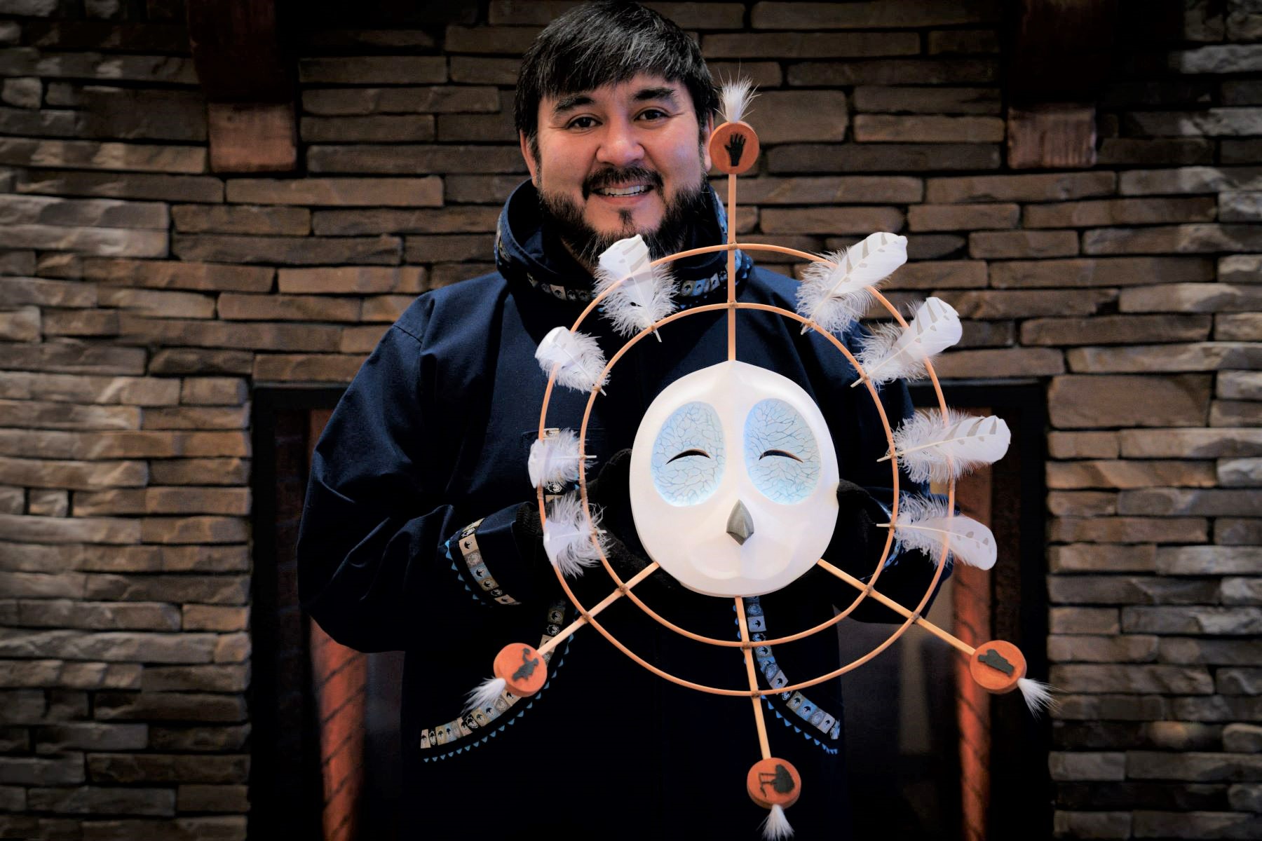 Artist David Angaiak with mask