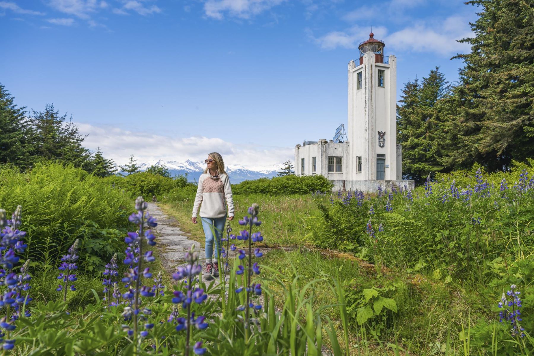 Woman and lighthouse in Juneau