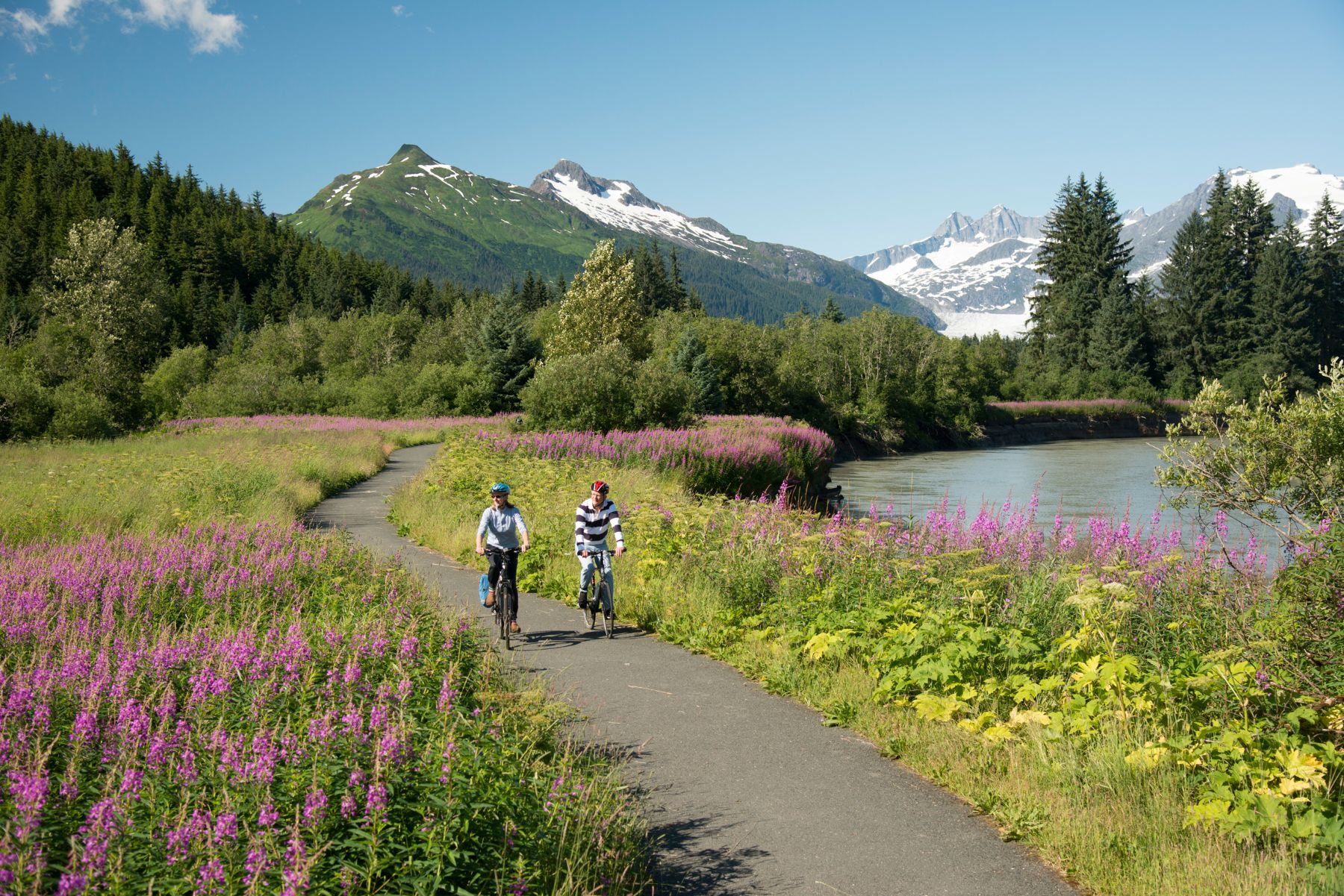 A couple biking near Mendenhall Glacier in Juneau