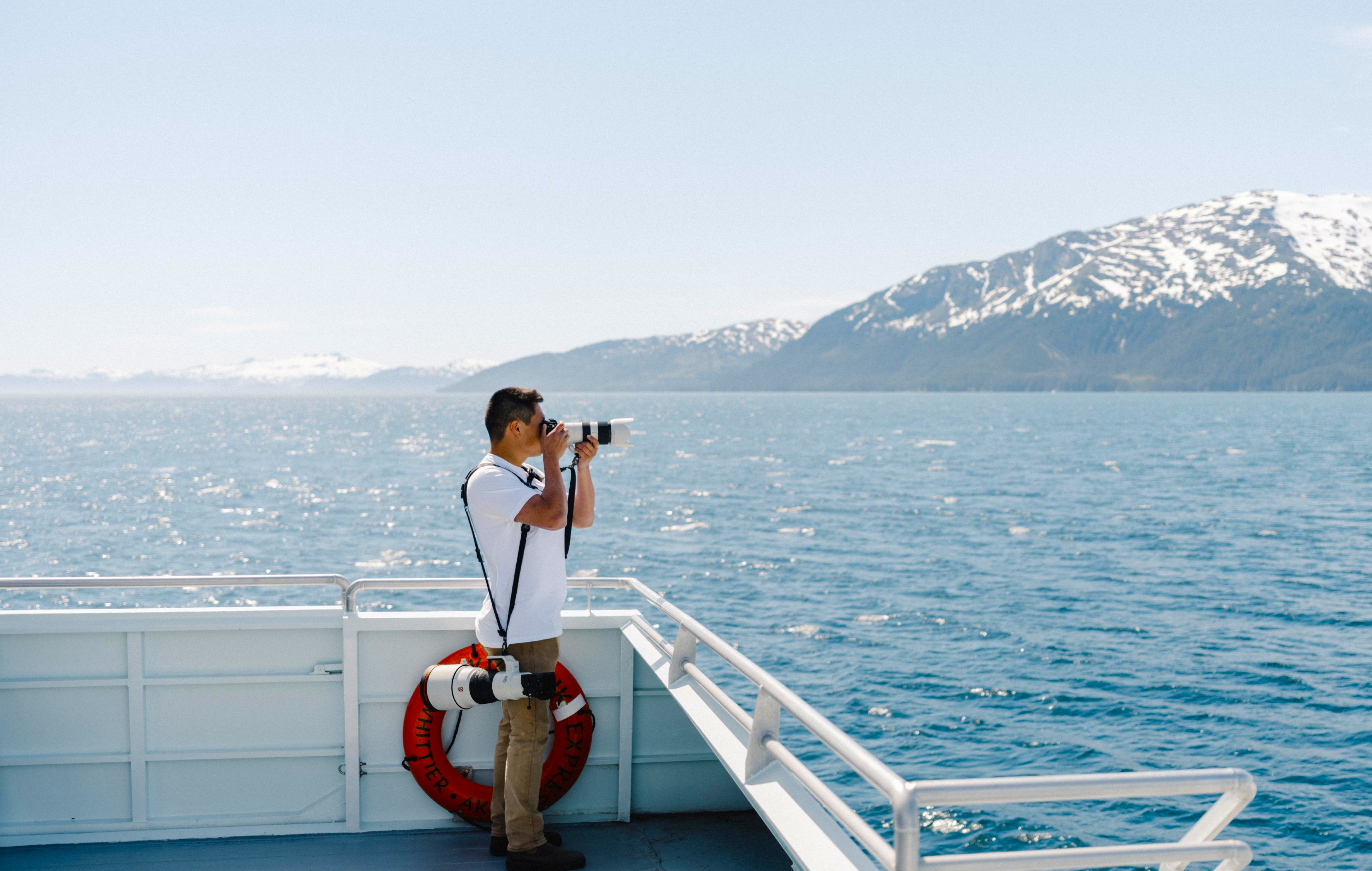 Man taking a photo in Prince William Sound