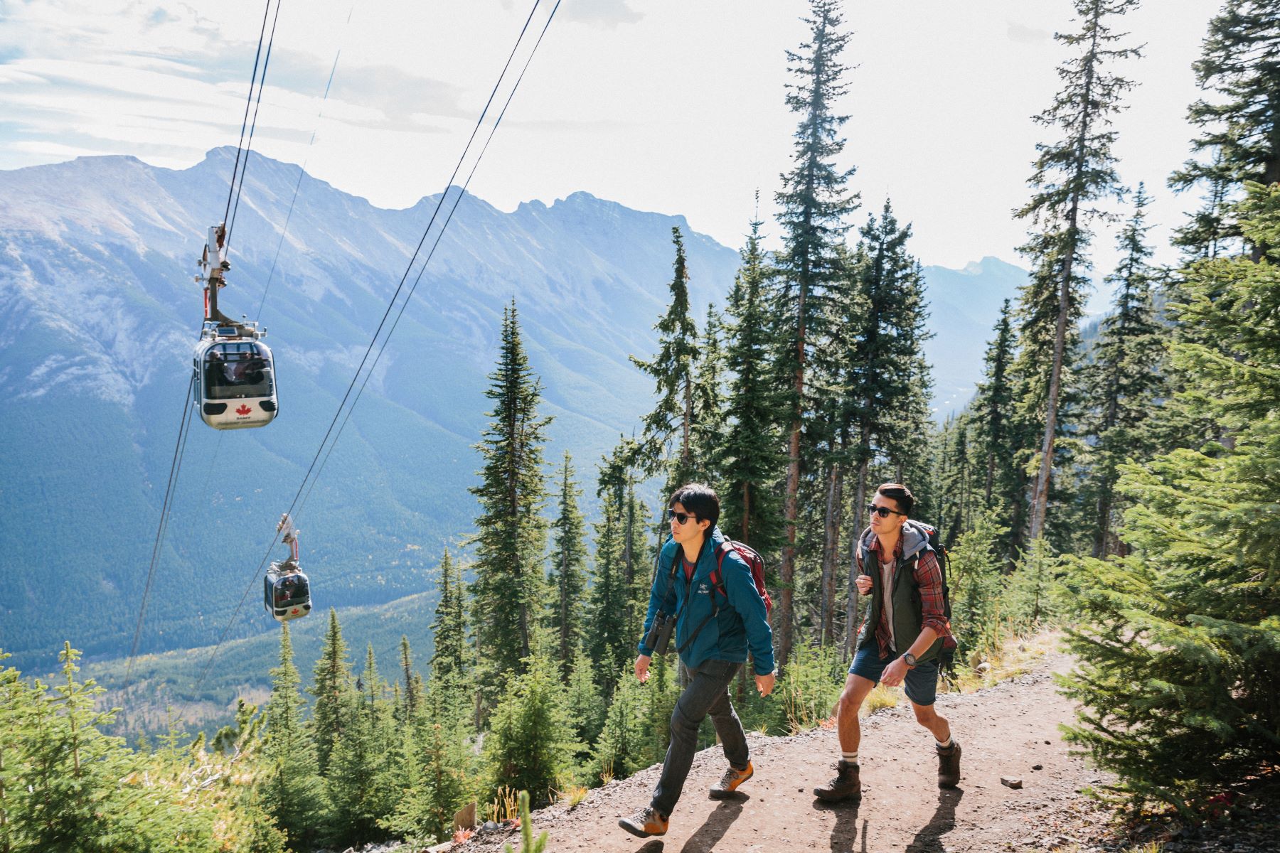Hikers going up Sulphur mountain with Banff Gondola's in the background, Alberta