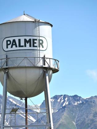 Palmer Water Tower with mountains in background