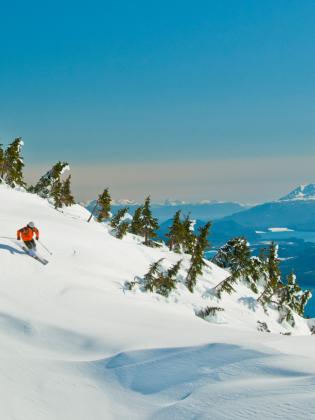 Person downhill skiing at Eaglecrest Ski Resort in Juneau