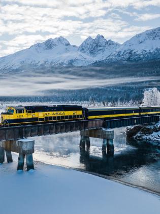 Alaska Railroad Aurora Winter Train going over a bridge