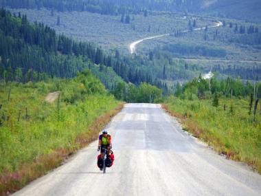 A cyclist on an an Alaska roadway