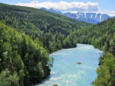 River rafters float the Kenai River near Cooper Landing, Alaska