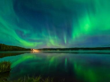 Northern lights over Birch Lake in Birch Lake State Recreation Area in Interior Alaska