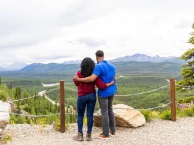 Two people view the scenery in the Denali Park area