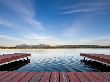 Sunset over a lake and dock in Wasilla, Alaska