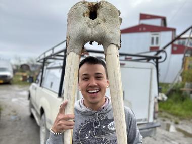 Bailey McCallson holding walrus skull