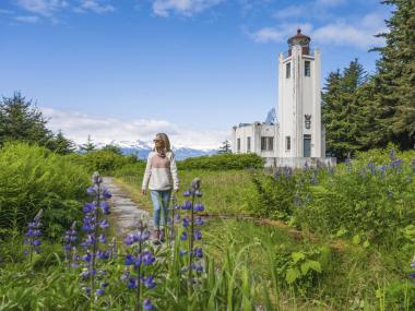 Woman and lighthouse in Juneau