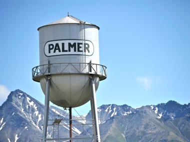 Palmer Water Tower with mountains in background