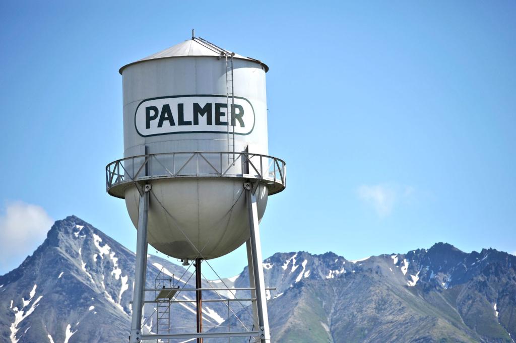 Palmer Water Tower with mountains in background