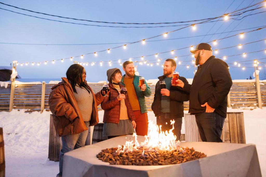 A group of friends enjoys a beer at HooDoo Brewing Company in Fairbanks