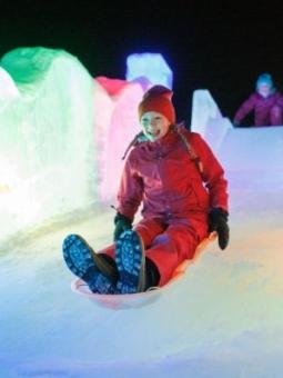Girl on ice slide at World Ice Art Championships