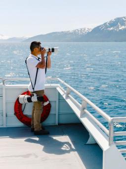 Man taking a photo in Prince William Sound