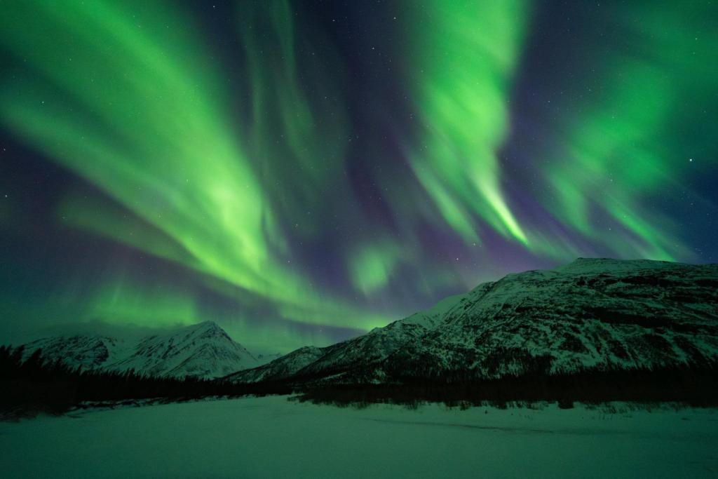 Northern lights over mountains in Interior Alaska