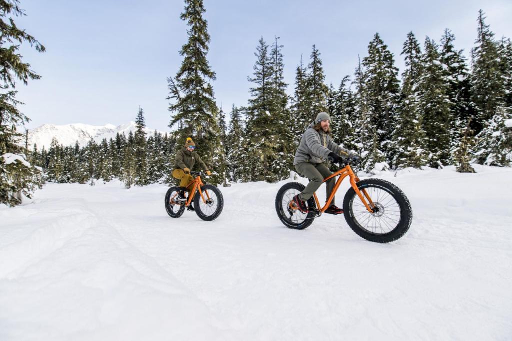 Two people fat tire biking in Girdwood in winter