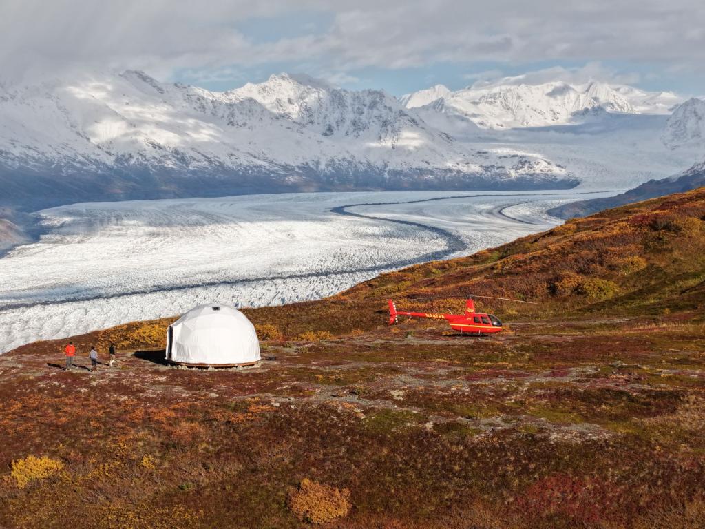 Outbound Heli Adventures Dome and helicopter overlooking glacier