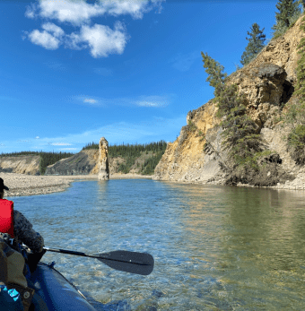 A stone column emerges in front of us on our Porcupine River float Photo