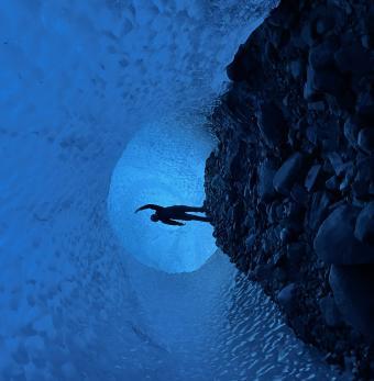 Bright blue ice caves are hidden under the ice! Photo